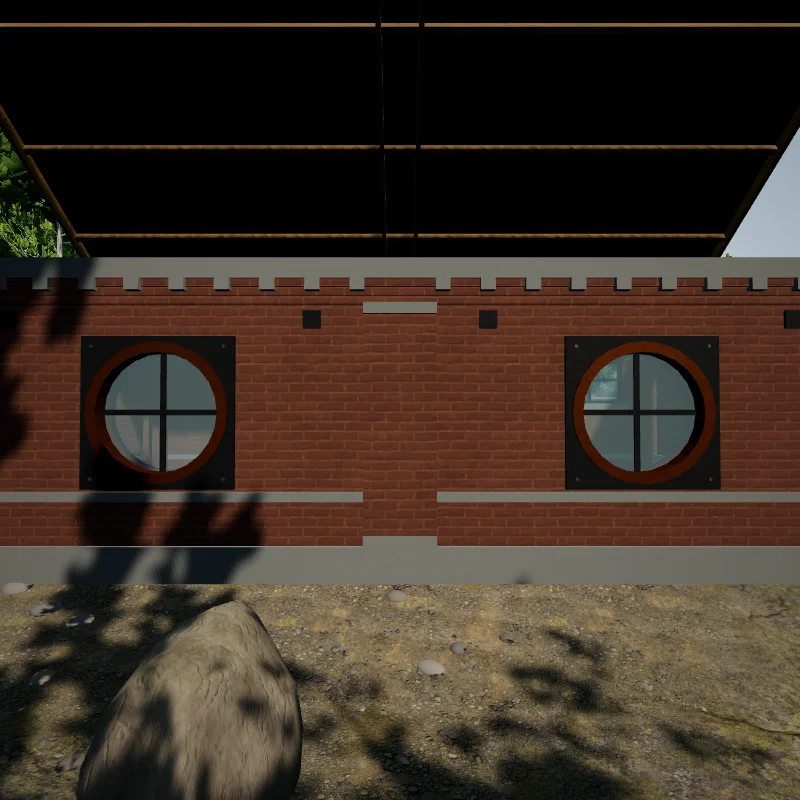 A brick wall with two copper-rimmed portholes